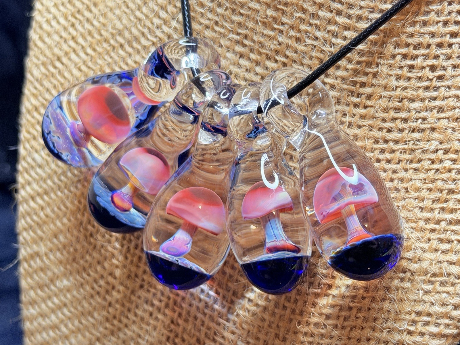 Glass Teardrop Mushroom Pendant in reds and purples with cobalt blue base