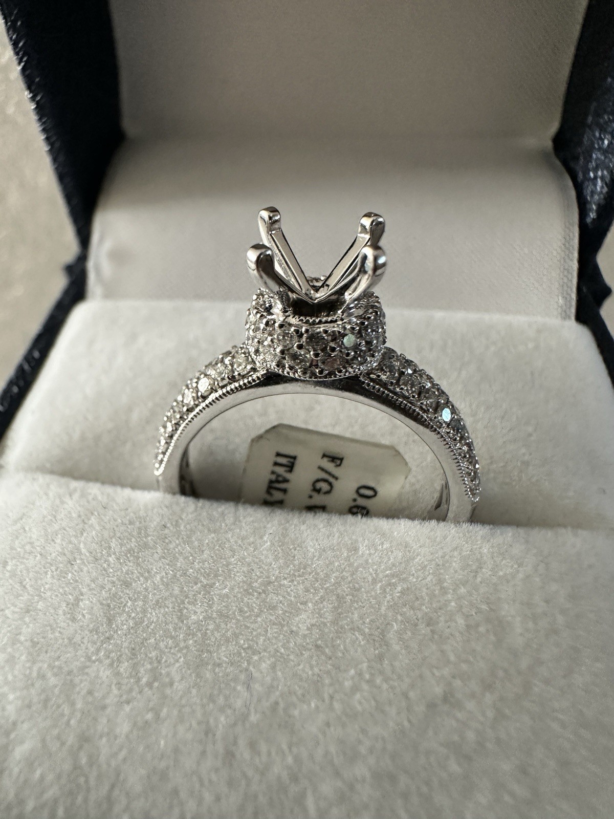14kt,white gold semi mount ring with 0.62ct, VS2 clarity size 6, 4.40 grams.