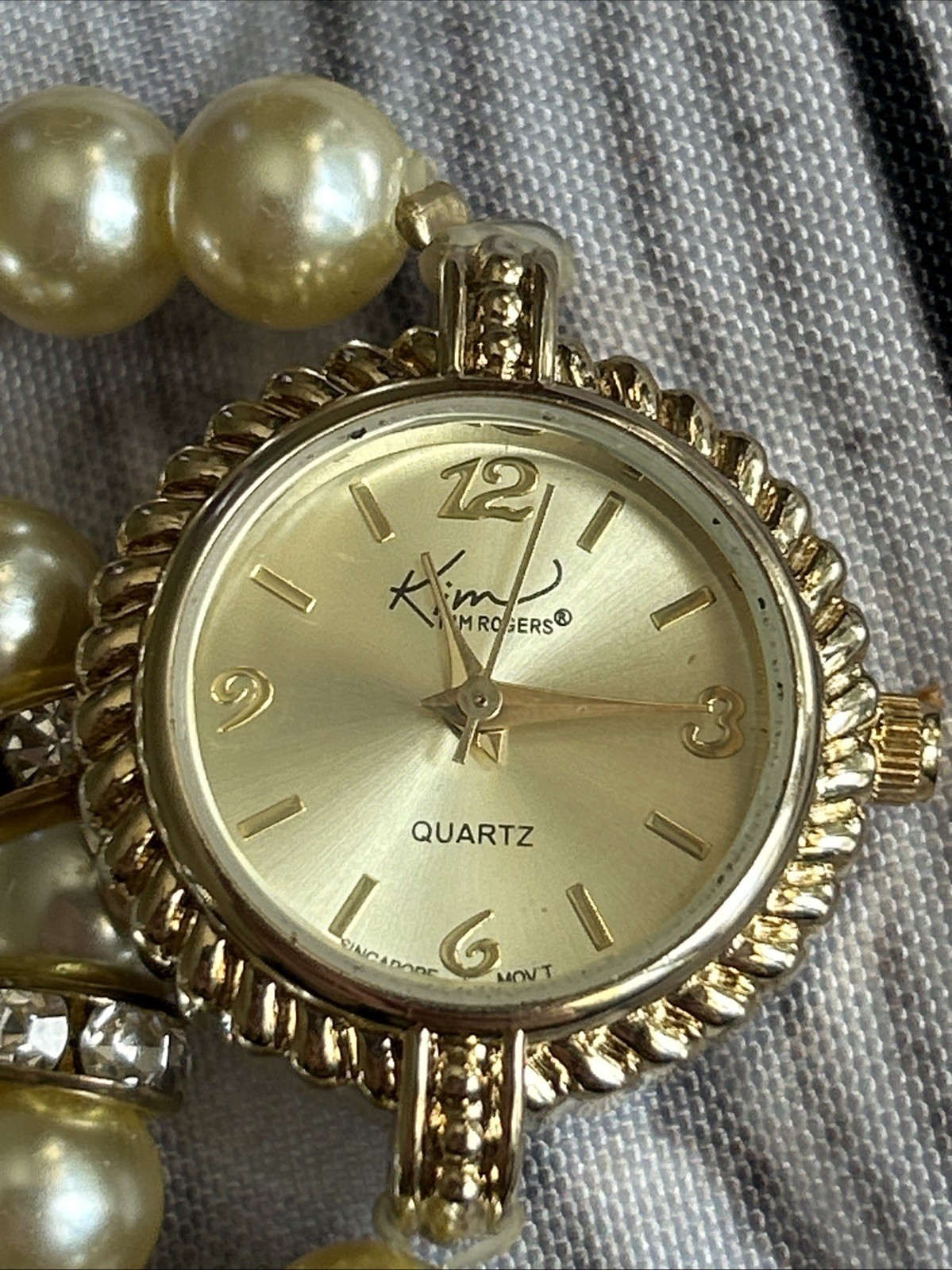 Kim Rogers Gold Tone Pearl Wrap Style Band Watch
