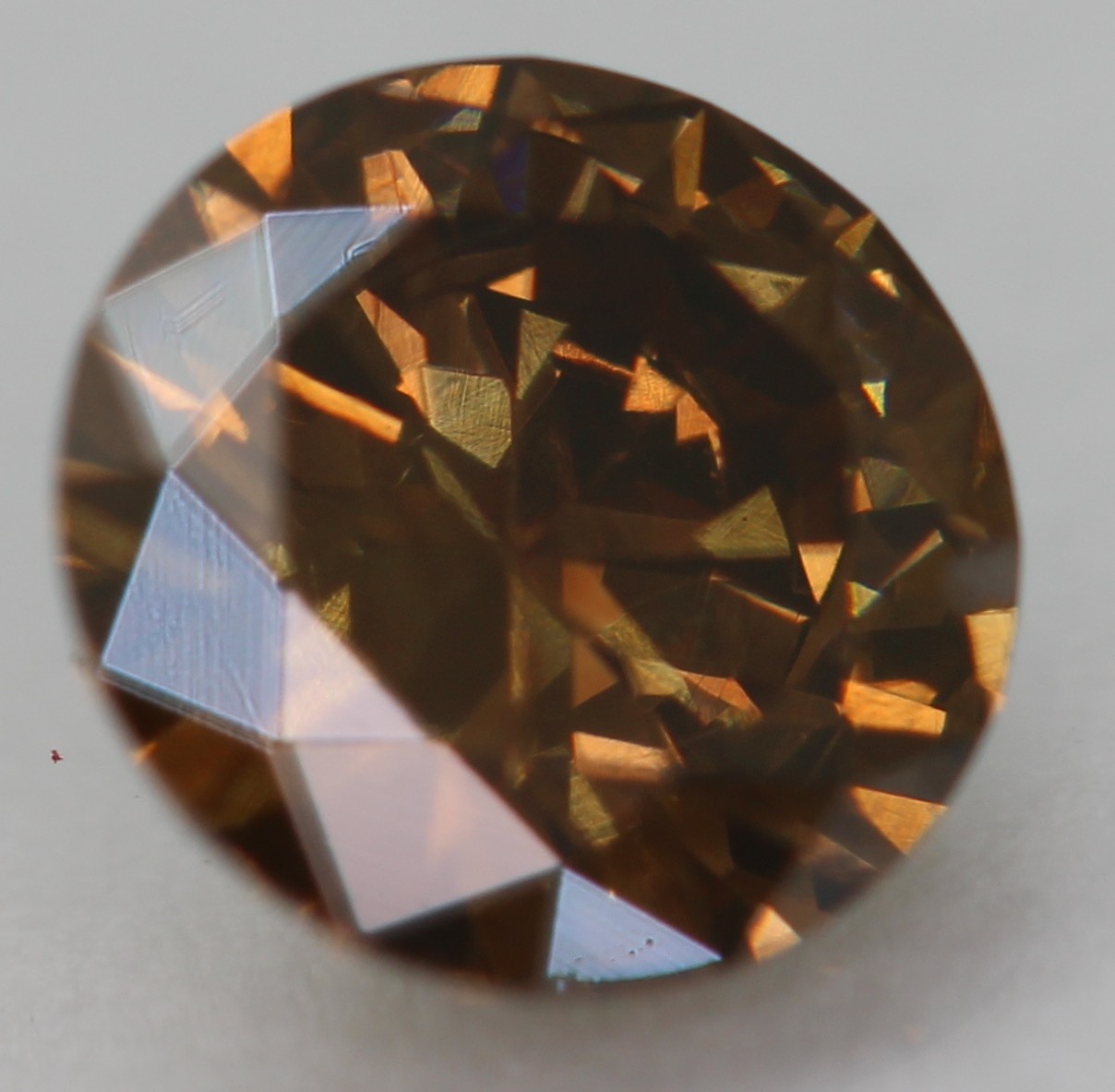 0.52 Carat Orangy Brown VVS2 Round Brilliant Natural Enhanced Diamond 5.4m VIDEO