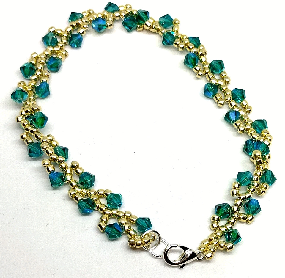 Bracelet 8-inch – 4mm Aurora Borealis Color Crystal Bicone Beads w/ Gold Beads.