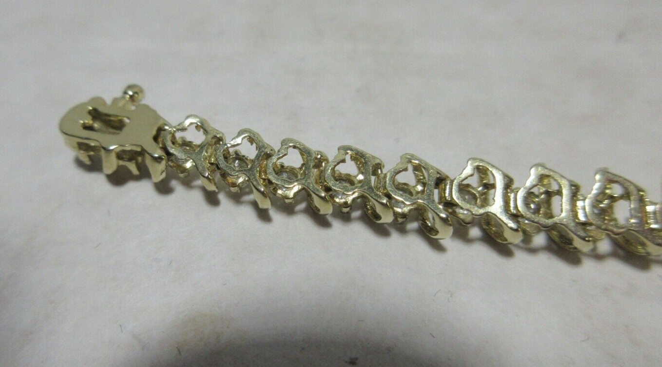 14K Yellow Gold tennis Bracelet, Wt 12.5g, locking 42 x 2.5mm diamonds si2 I1