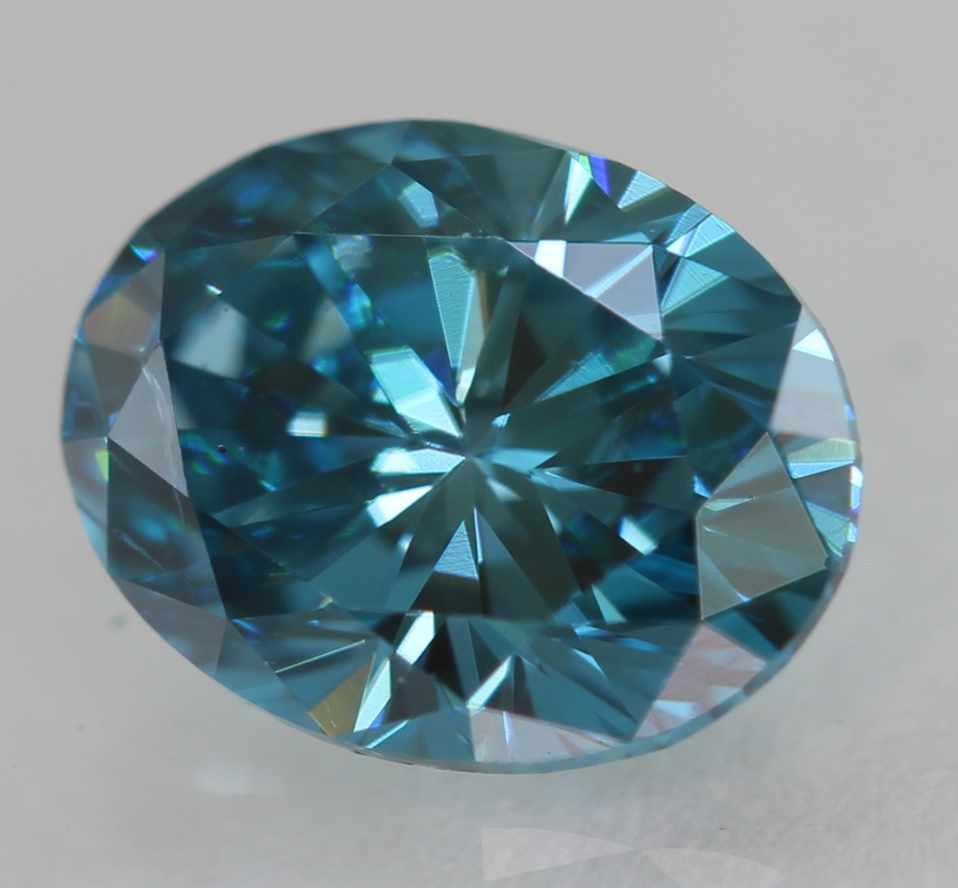 Cert 0.57 Carat Fancy Vivid Blue VVS1 Oval Natural Enhanced Diamond 5.99×4.63mm