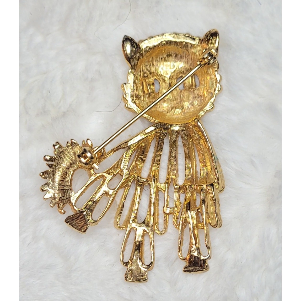Vintage gold-tone cat brooch with red rhinestone eyes and white beaded accents