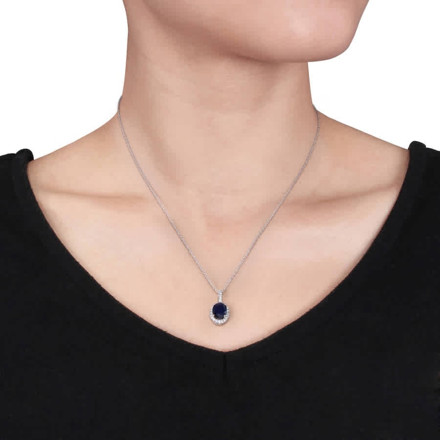 AMOUR Oval Diffused Sapphire and 1/4 CT TW Diamond Halo Pendant with Chain In