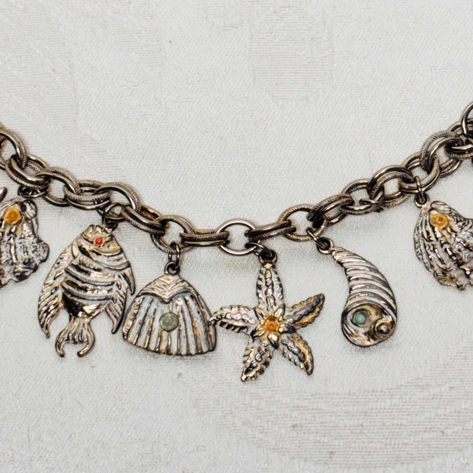 BRACELET ocean life charms starfish shells fish lobster fold over clasp vintage