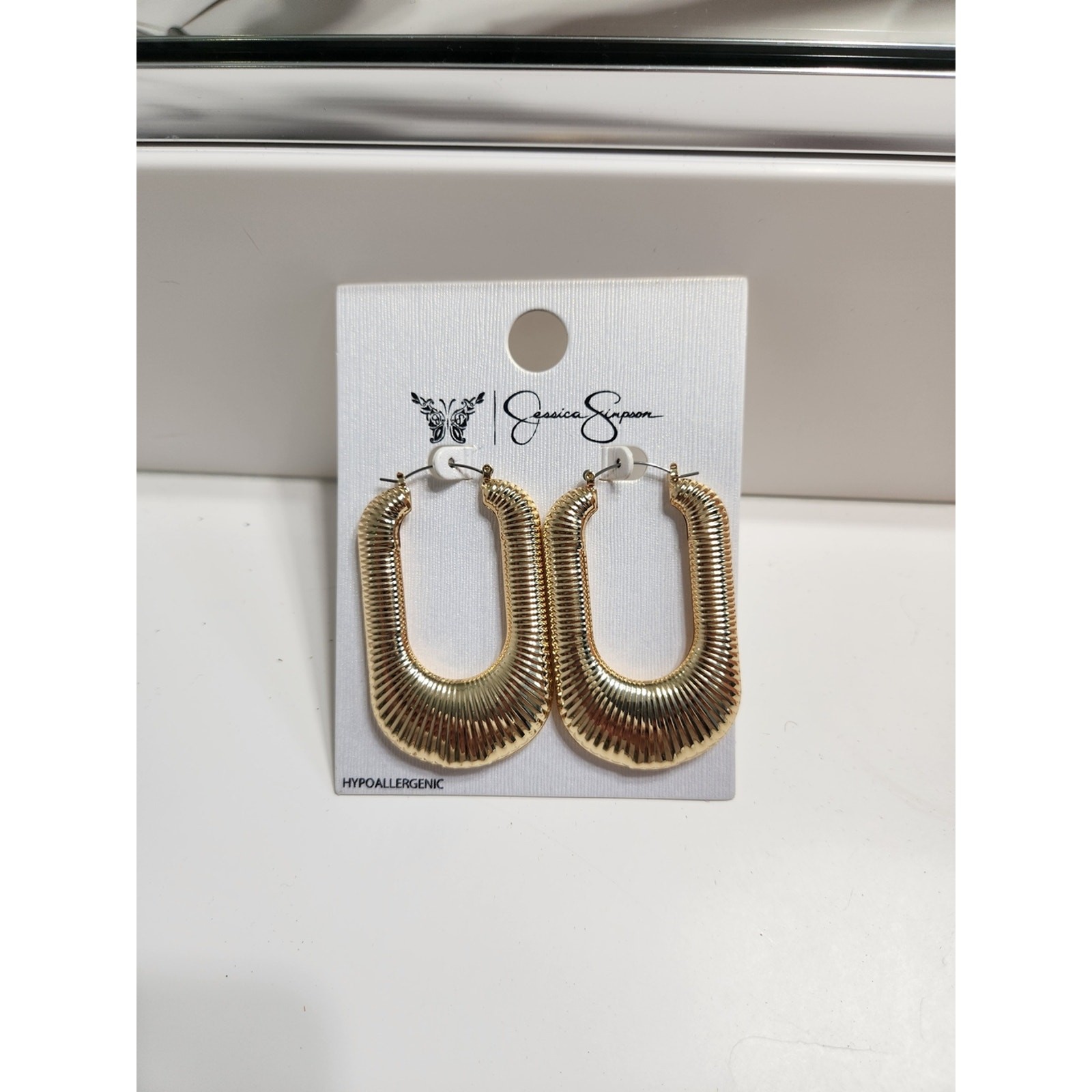 Jessica Simpson Shiny Gold Textured Oval Hoop Earrings