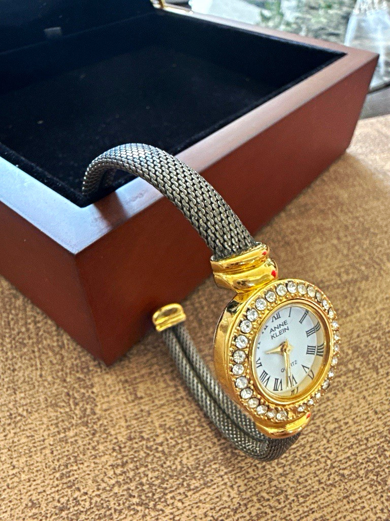 Anne Klein Women’s Quartz Dress Watch Gold Case Silver Bangle White Roman Dial