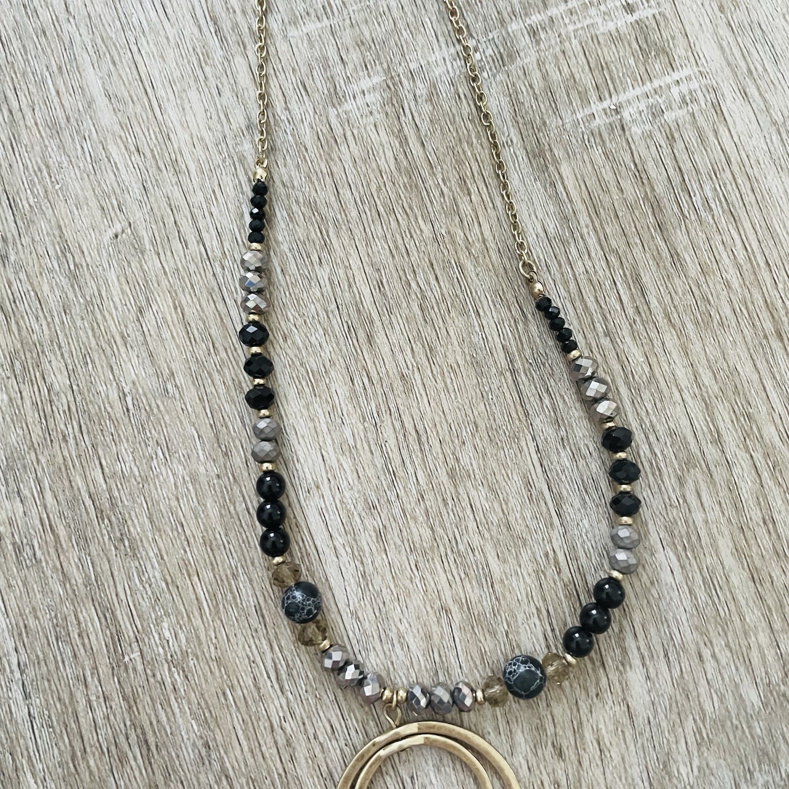 Gold Double Ring Pendant Necklace with Black and Gray Beads
