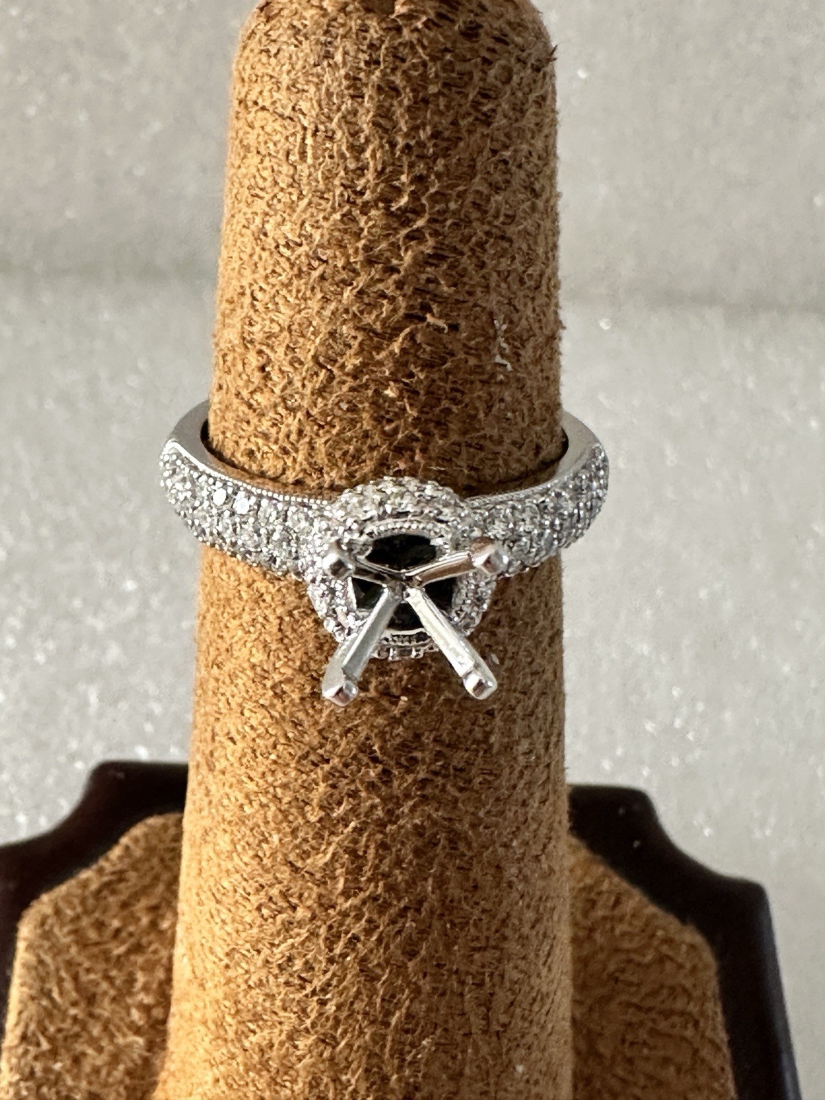 14kt,white gold semi mount ring with 0.62ct, VS2 clarity size 6, 4.40 grams.