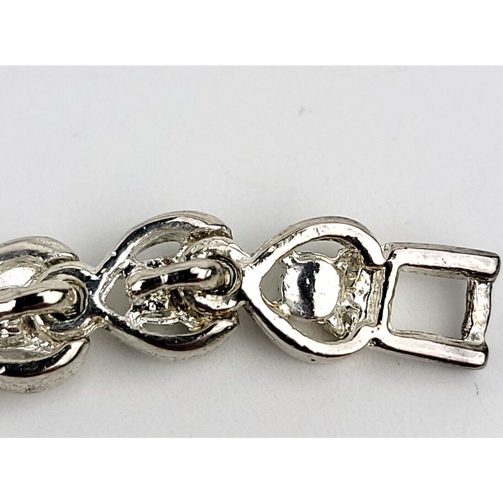 Heart Shaped Tennis Bracelet Silver Tone Link with Rhinestones Fold Over Clasp