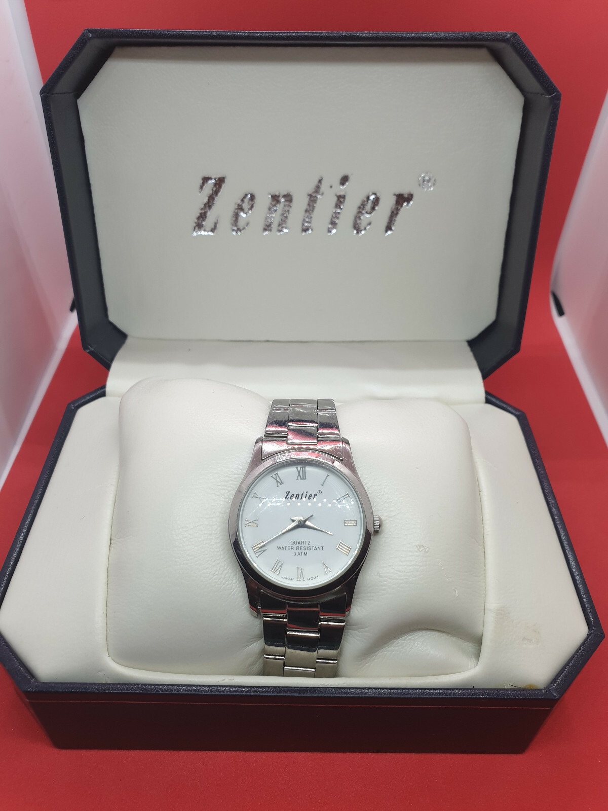 mens zentier 3atm chrome bracelet watch,white face,silver hands.in its box.