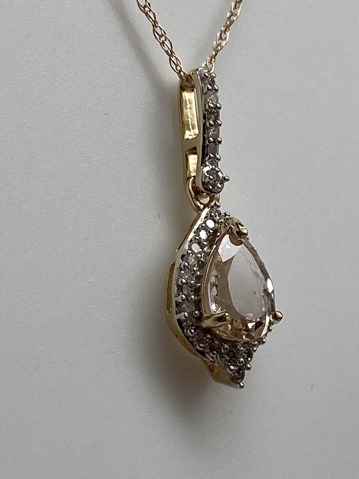 10K Yellow Gold Pear Shape Morganite and 0.11ct twt. Diamond Pendant with Chain