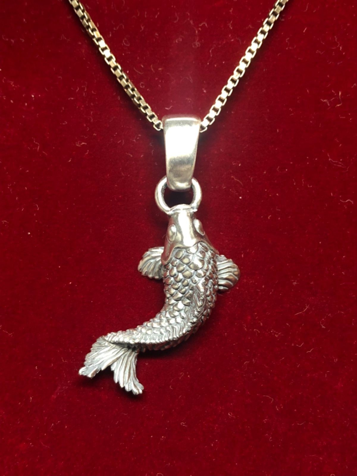 Ascending koi pendant top