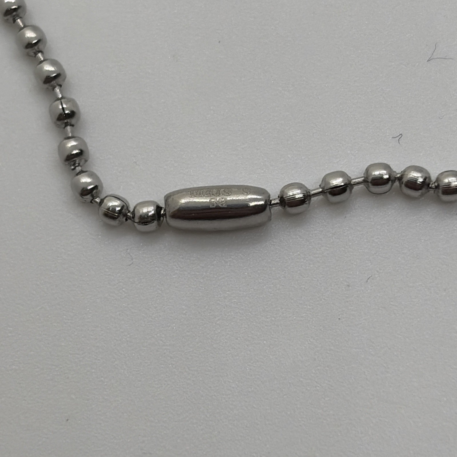 Stainless Steel Pendant With Silver And Black Charm With Stars On A 23” Chain