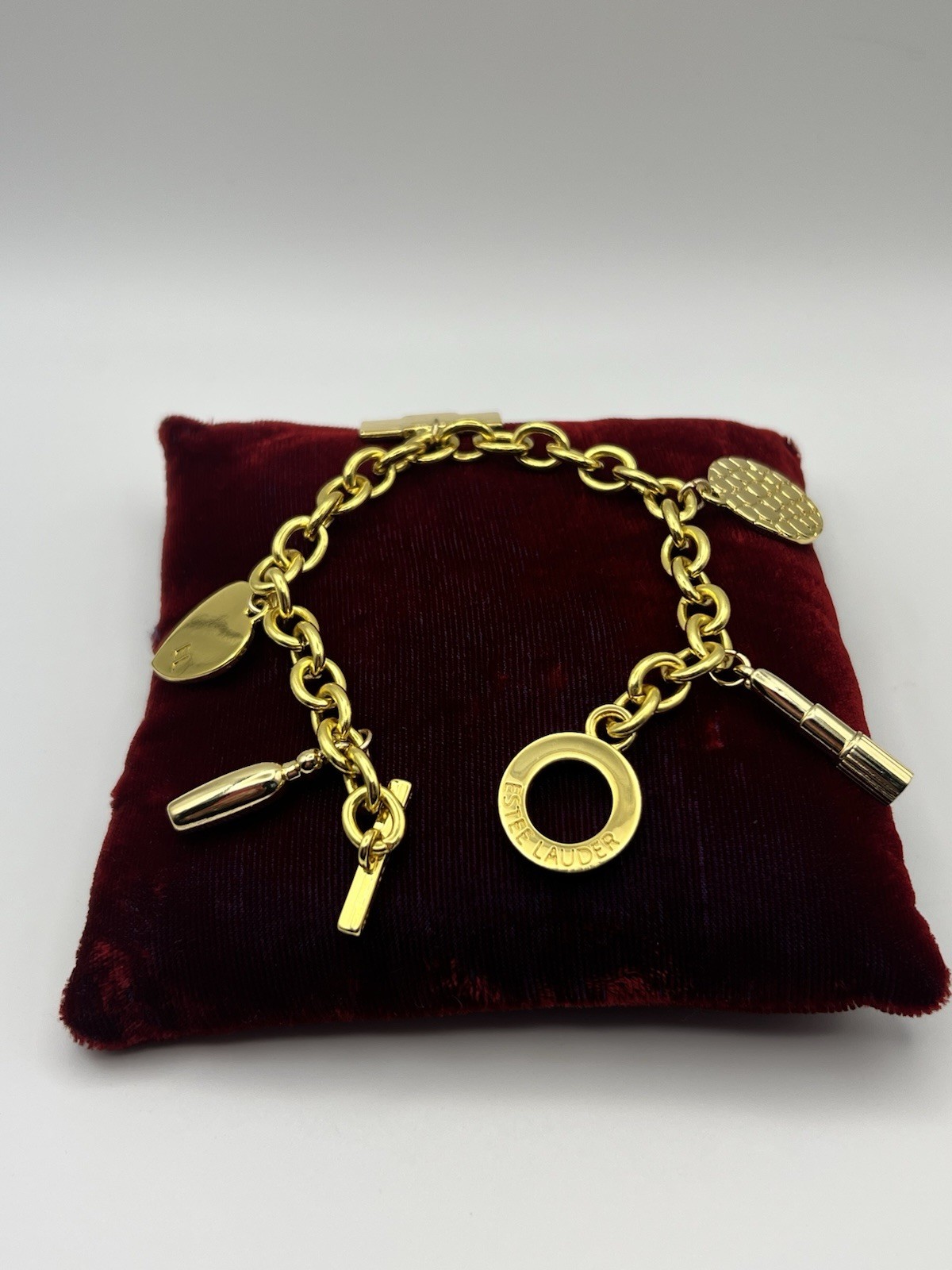 Vintage ESTEE LAUDER Runway Gold Tone Charm Bracelet Couture 7.5 ”