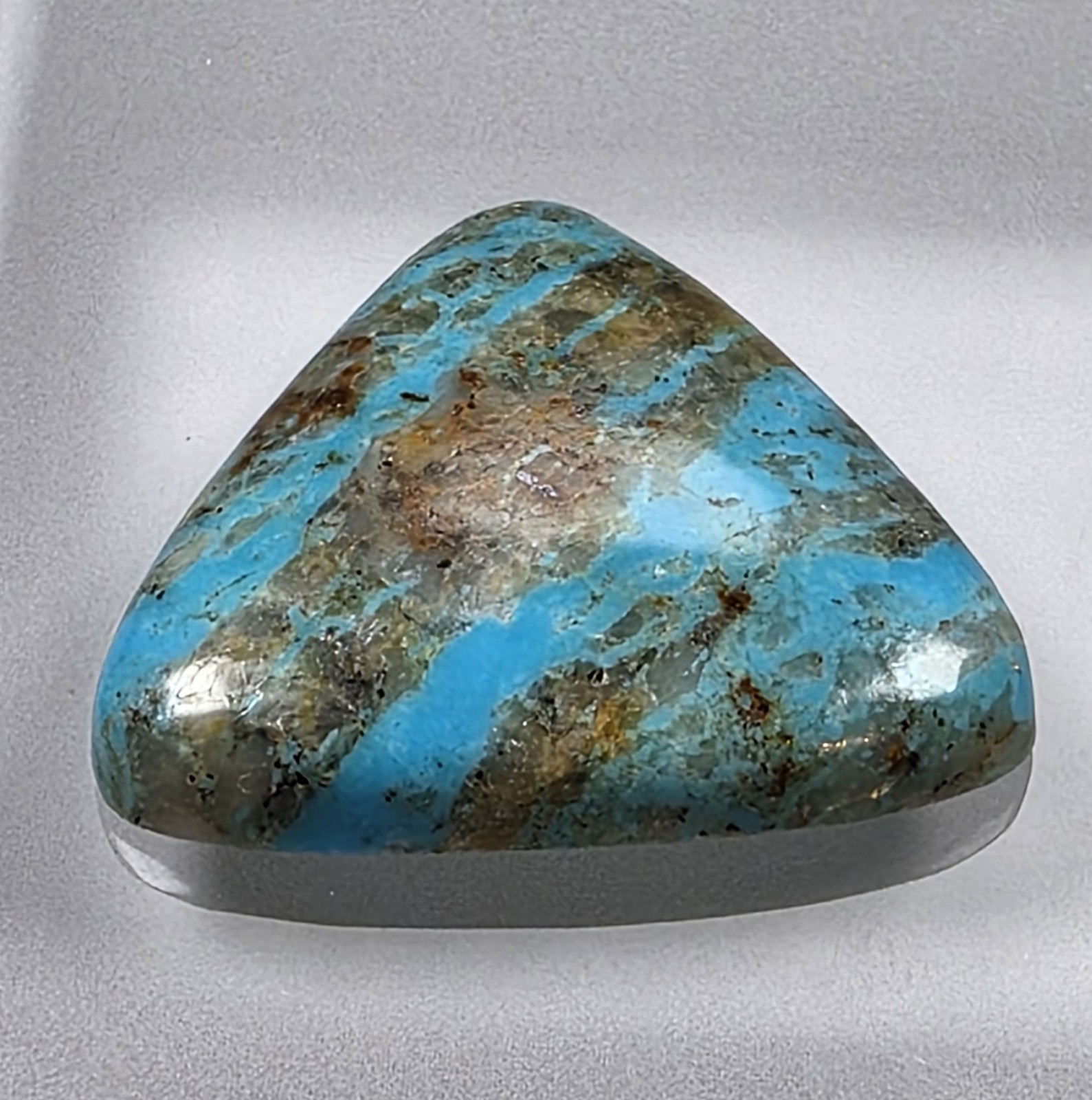 Kingman turquoise cabochon, boulder pattern, trillion cut, 30.49 carats, #B23