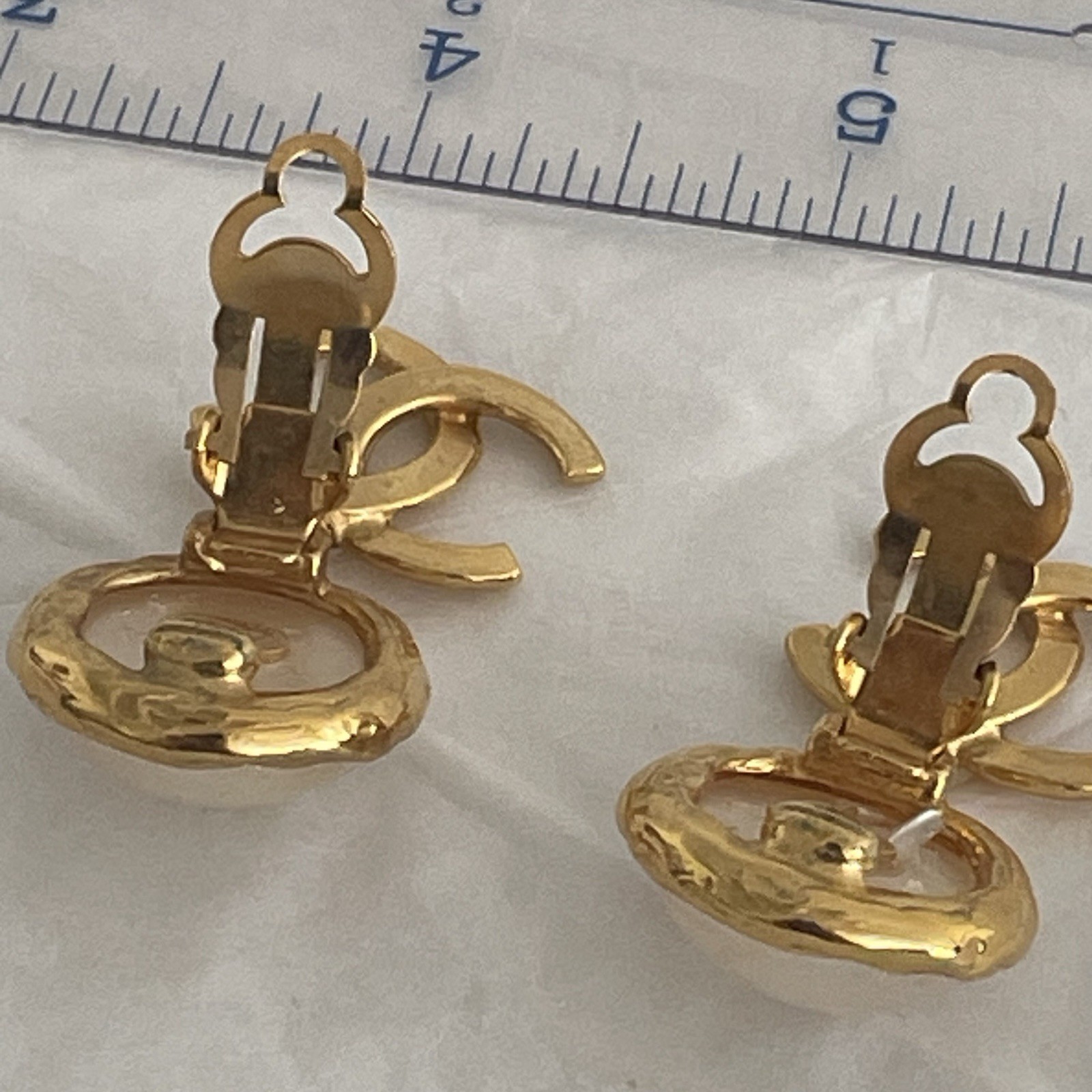 Auth. vtg CHANEL 1995 gold 3D CC logo dangle with round moonlight stone stamped