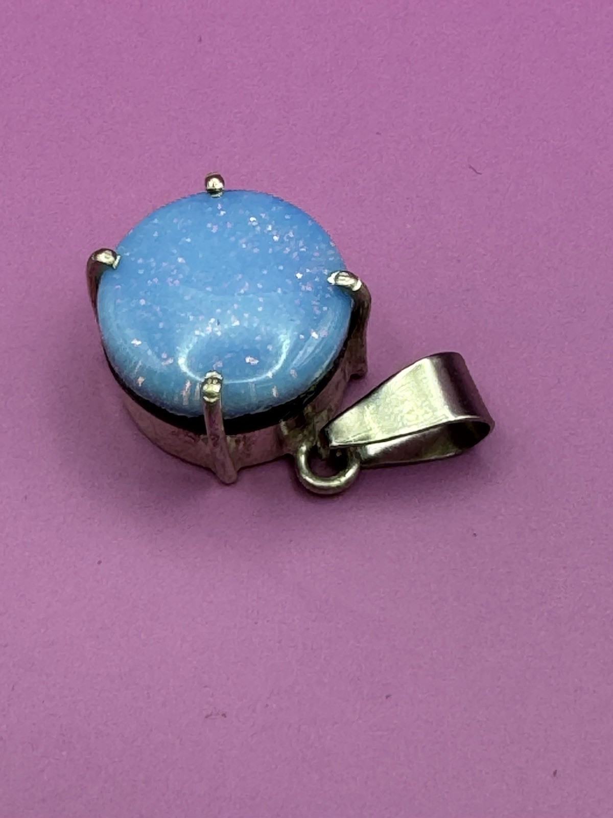aqua blue fire opal, lab-created doublet/triplet opal. Silver Plated Round