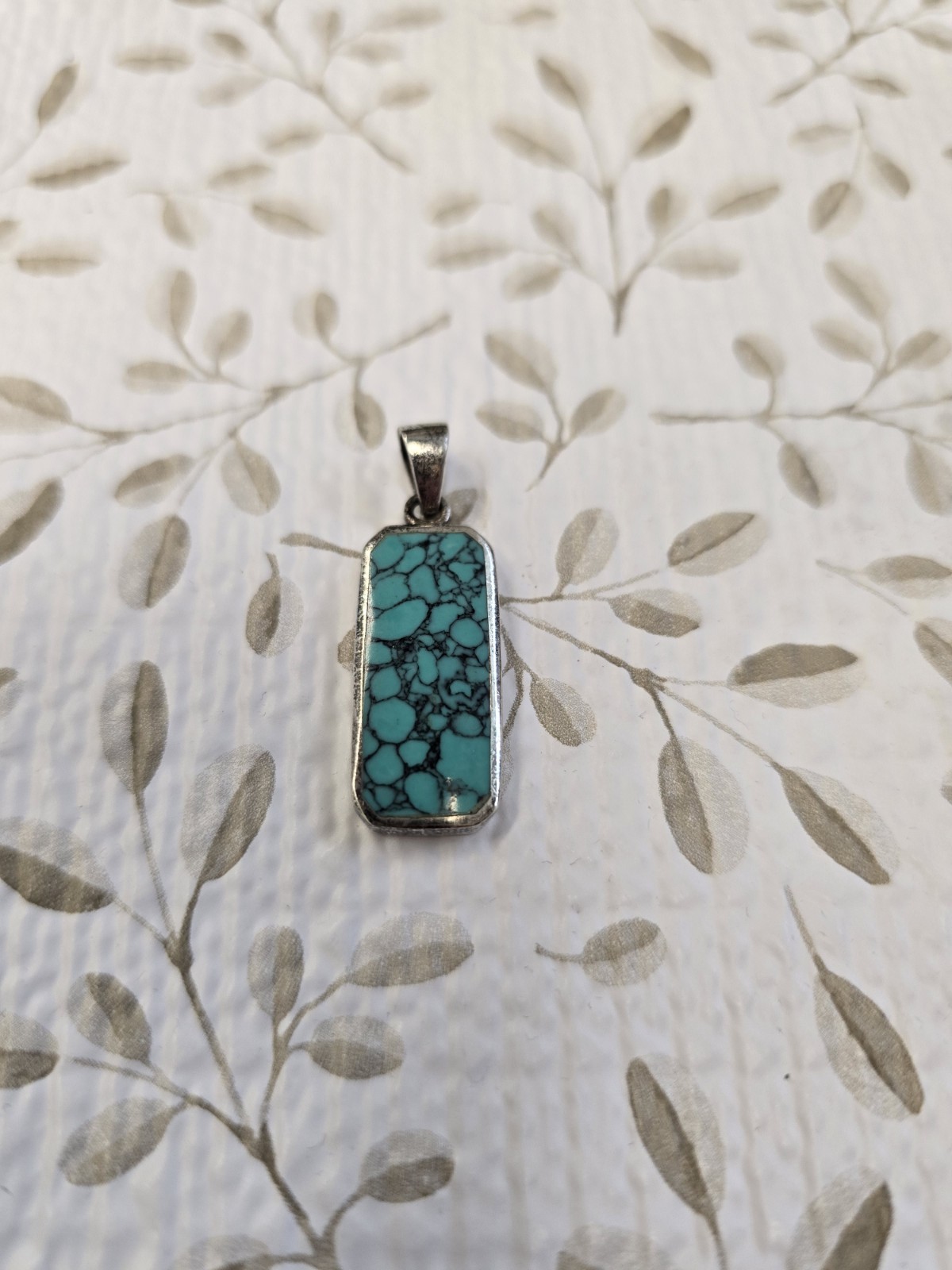 Sterling silver (925) turquoise pendant featuring a rectangular cabochon