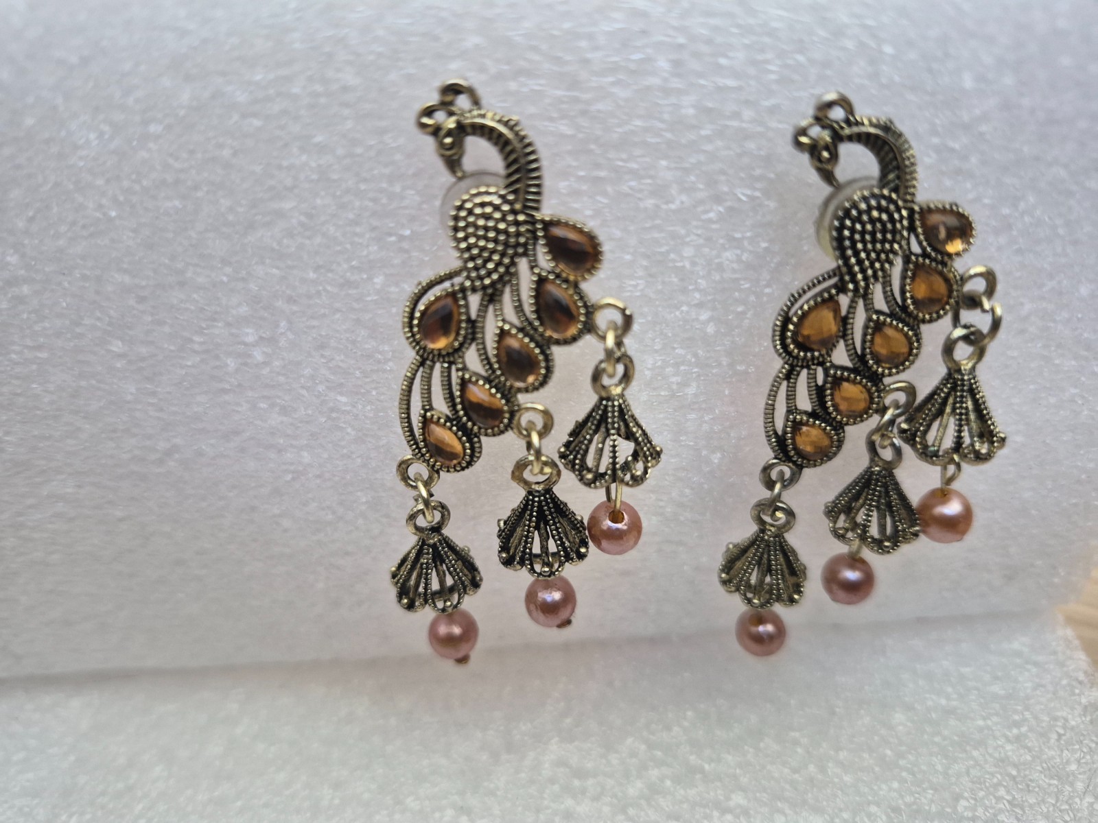 Peacock design Jhumka earrings for women with pearls and stone