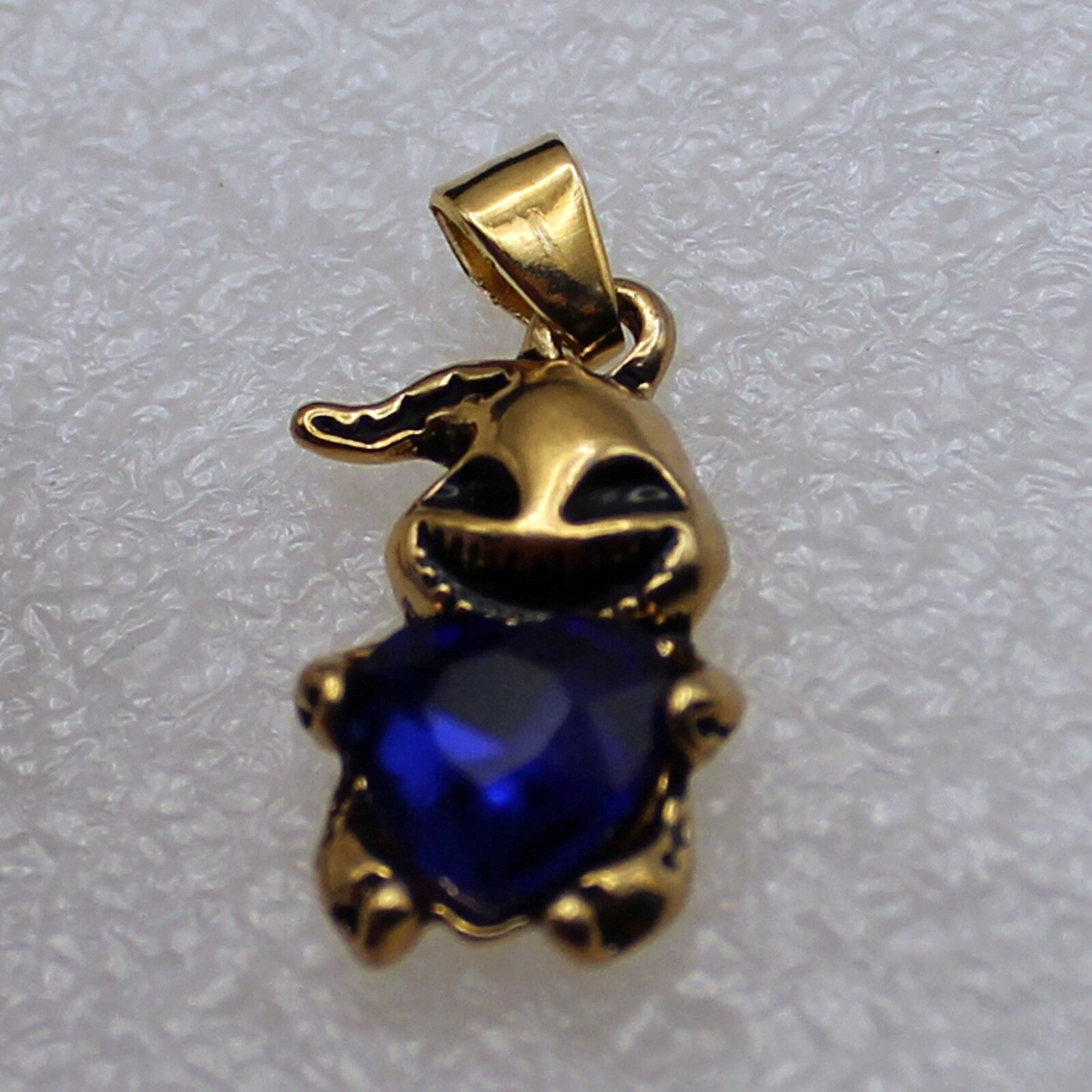 Gold Boogie Man Holding Blue Crystal Heart on 18″ Chain w/an Extension