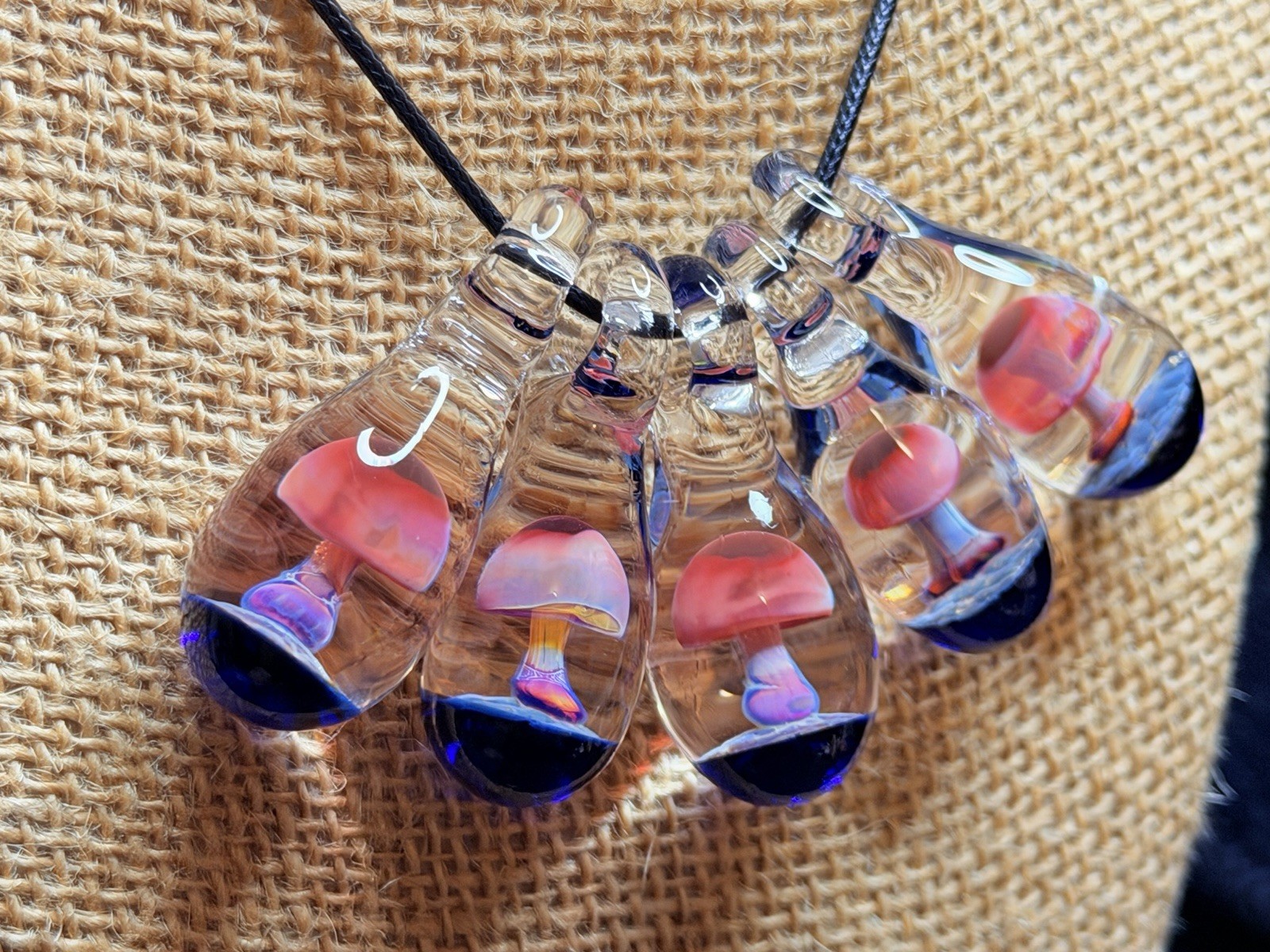 Glass Teardrop Mushroom Pendant in reds and purples with cobalt blue base
