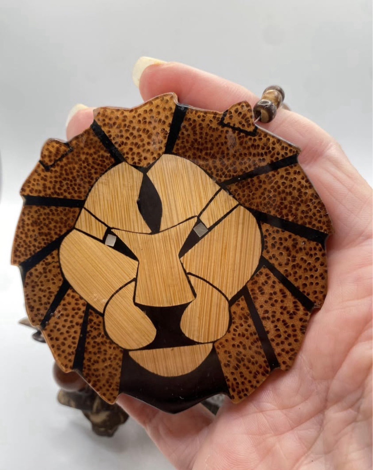Wood Beaded Necklace by designer Lee Sands . Lion Face Animal Charm Pendant, by