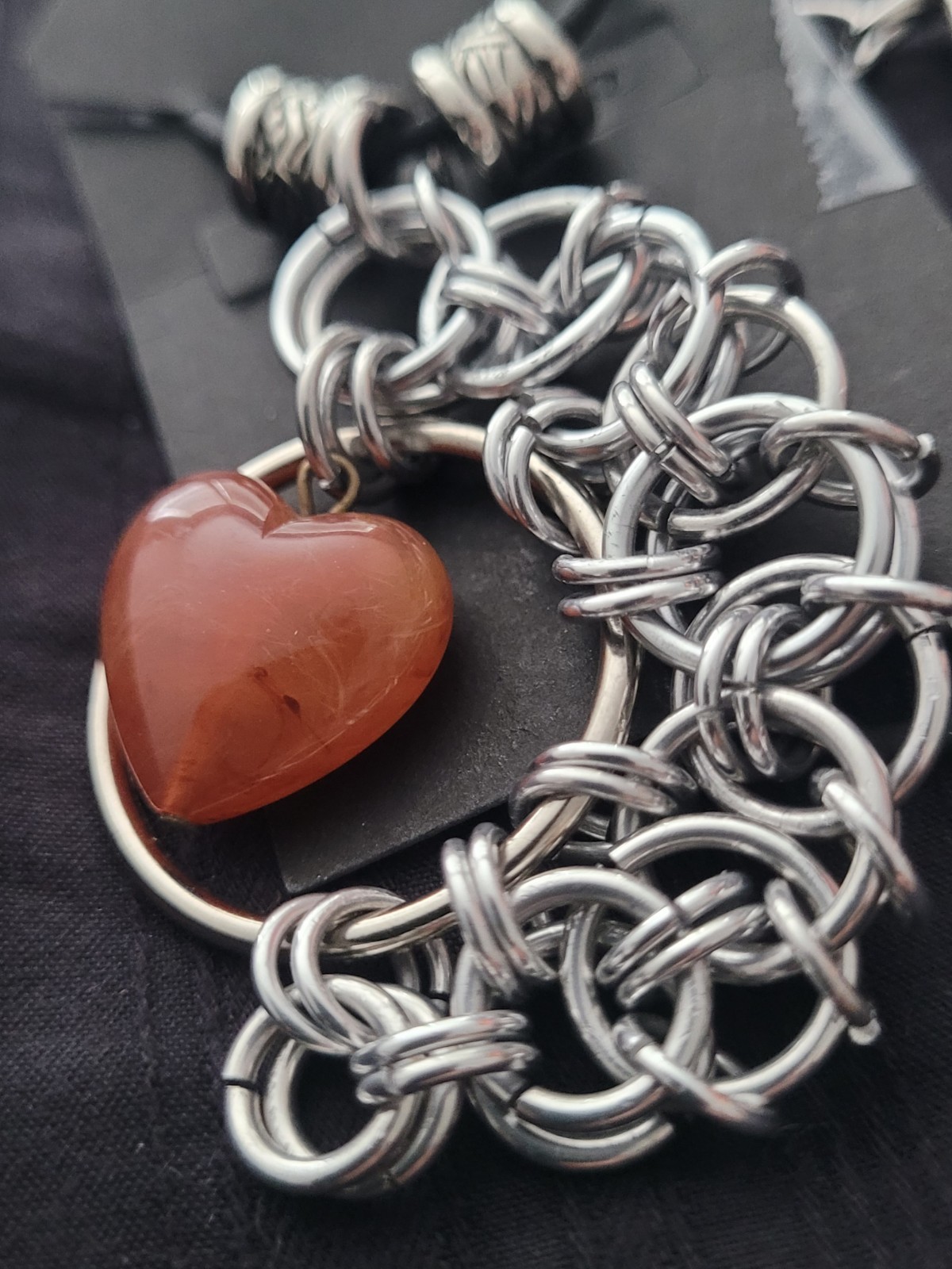 Heart Shaped orange Carnelian Stone In A Chainmail Pendant With Pewter Beads