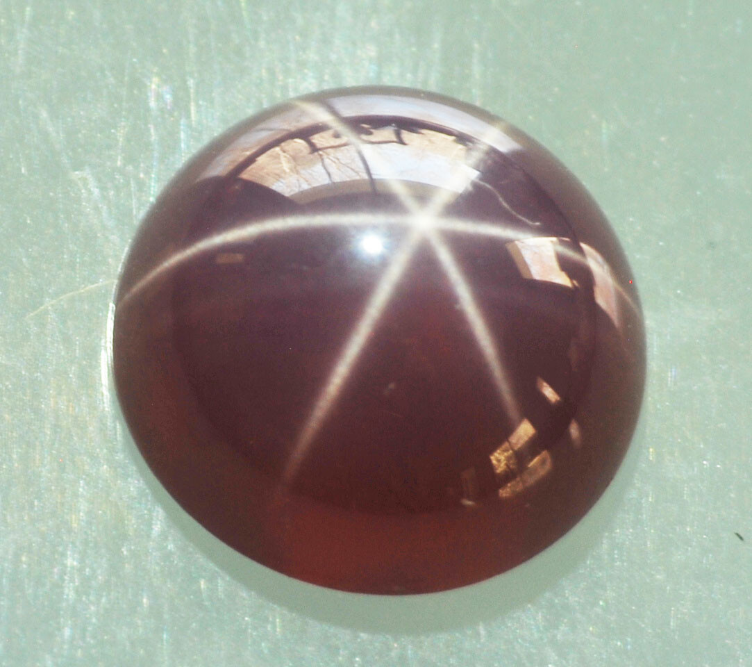 Burgundy, 4 mm round shape, Linde Star Sapphire – .35 carats,
