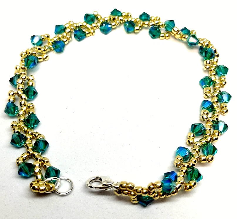 Bracelet 8-inch – 4mm Aurora Borealis Color Crystal Bicone Beads w/ Gold Beads.