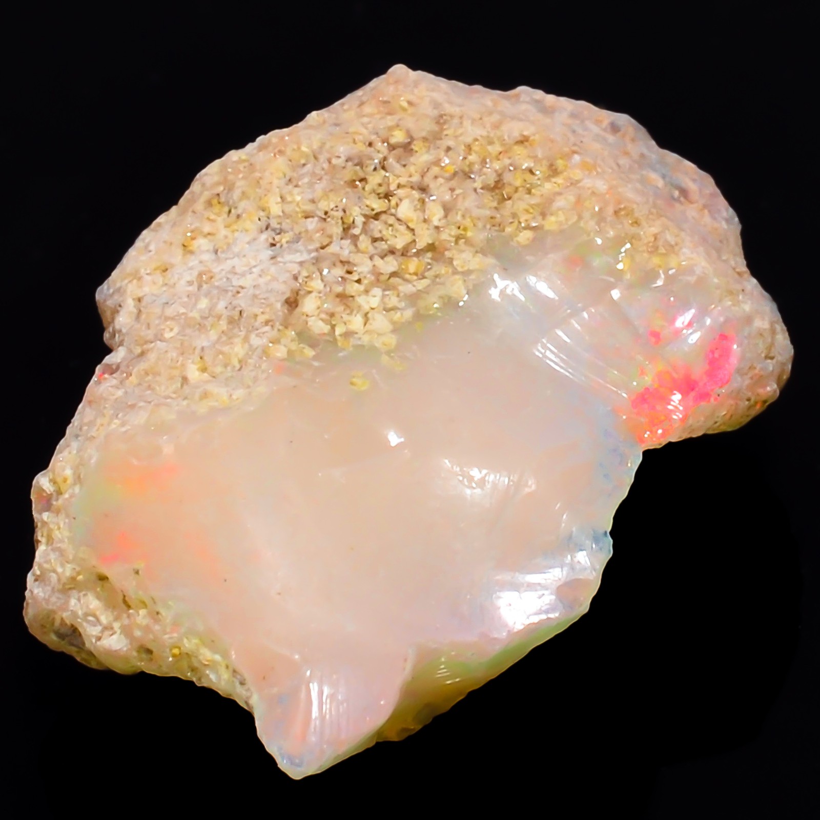Natural play of color Ethiopian Opal rough gemstone 9.05 Carat. (16 x 21 x 6 mm)