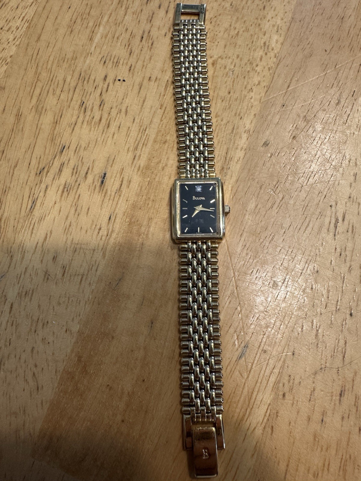 Bulova Quartz T4 Base Metal Bezel Stainless Steel Back Gold Tone With Black Dial
