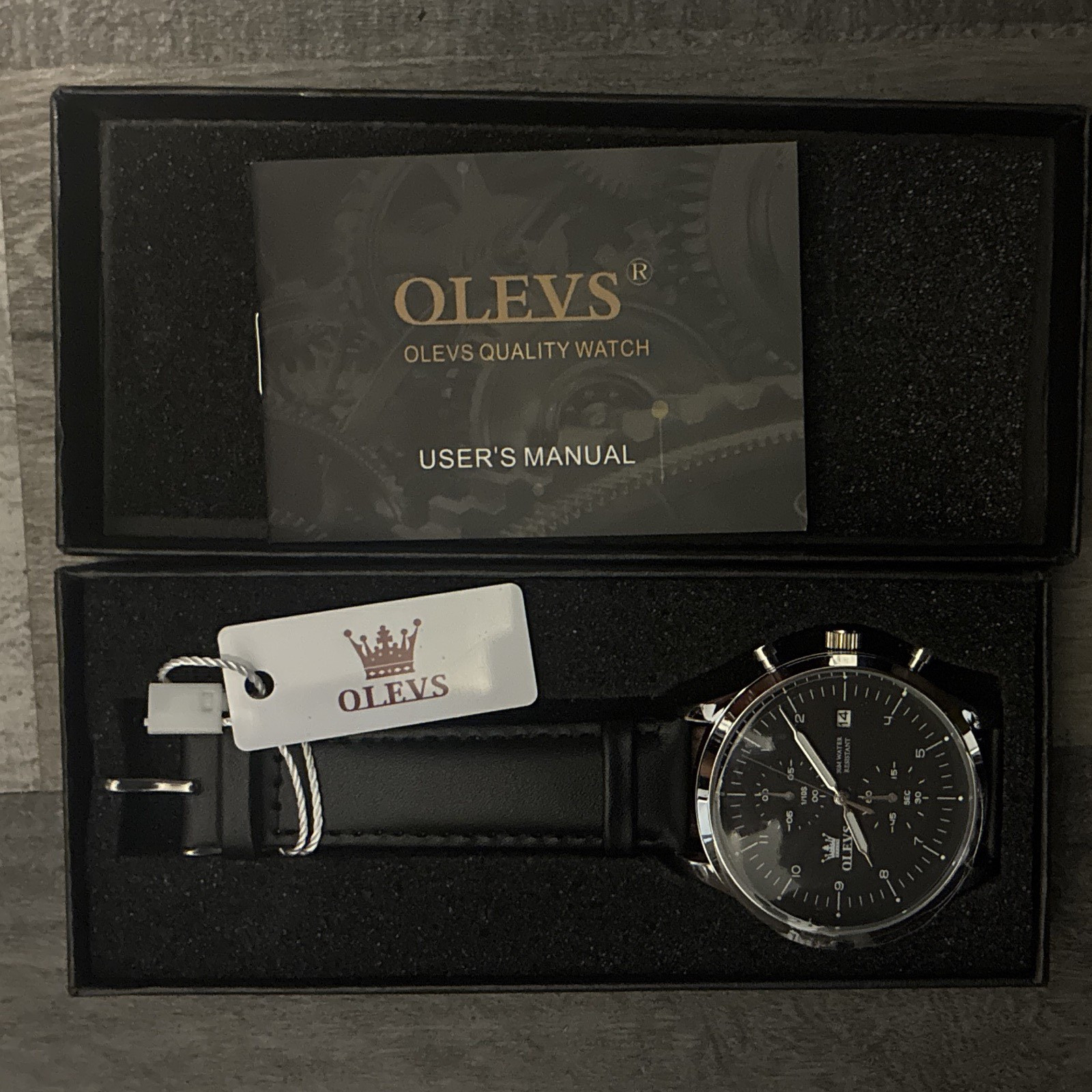 OLEVS Men’s Analog Quartz Date Black Dial Silver Case Black Leather Strap Box