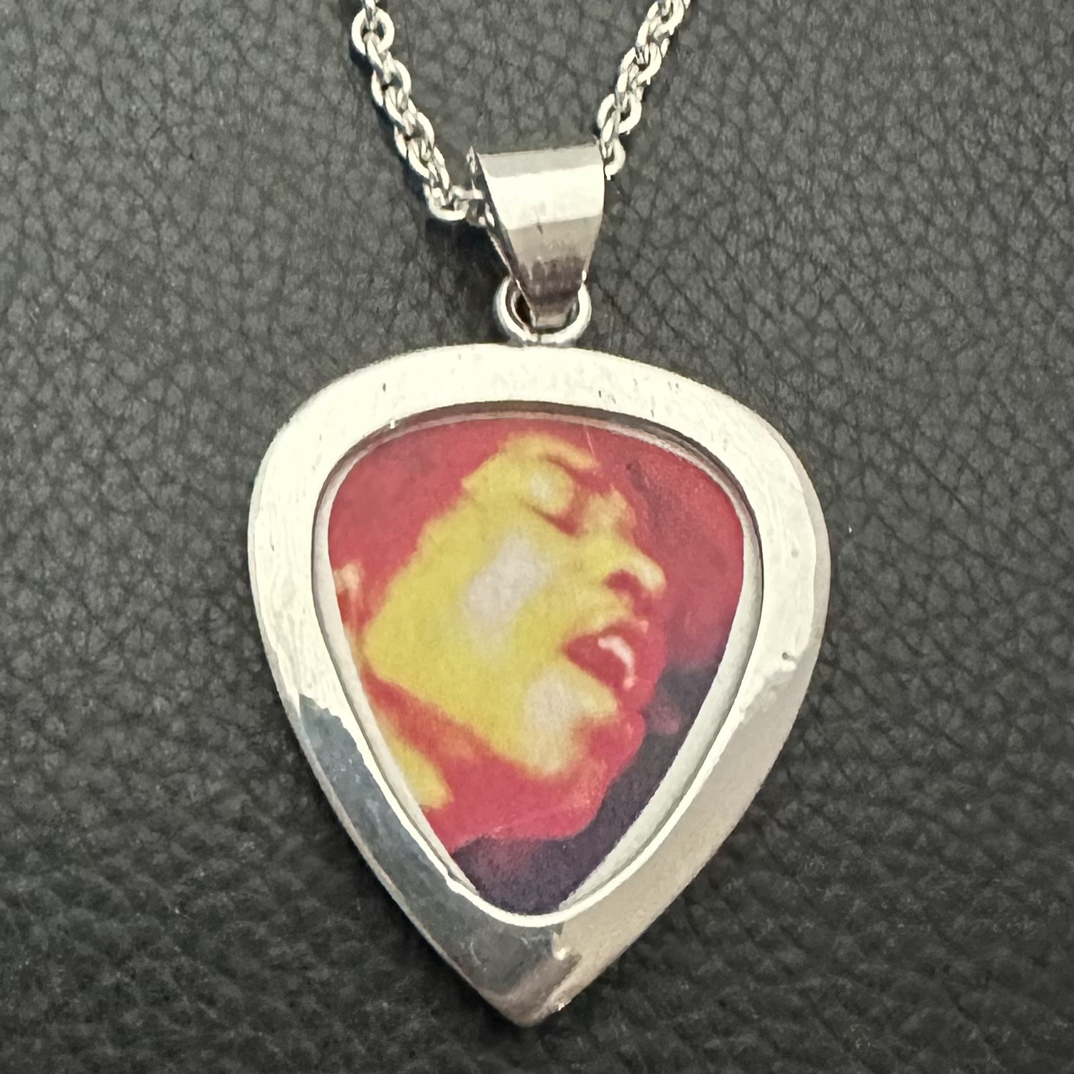 MJG STERLING SILVER. GUITAR PICK HOLDER/ PENDANT + CHAIN. JIMI. 12 GRAMS.