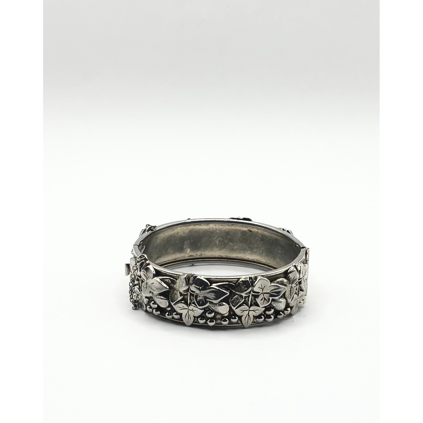 Vintage Silver Tone Embossed Floral Hinged Bangle Bracelet with Safety Chain