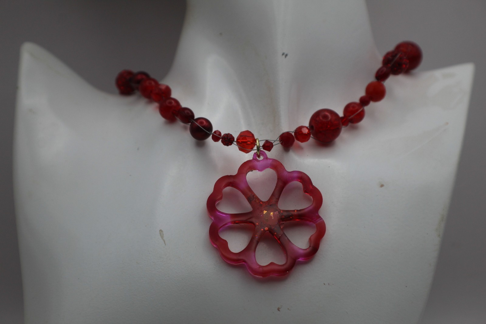 50 Shades Of Red Resin Flower Pendant On A Floating Beaded Necklace