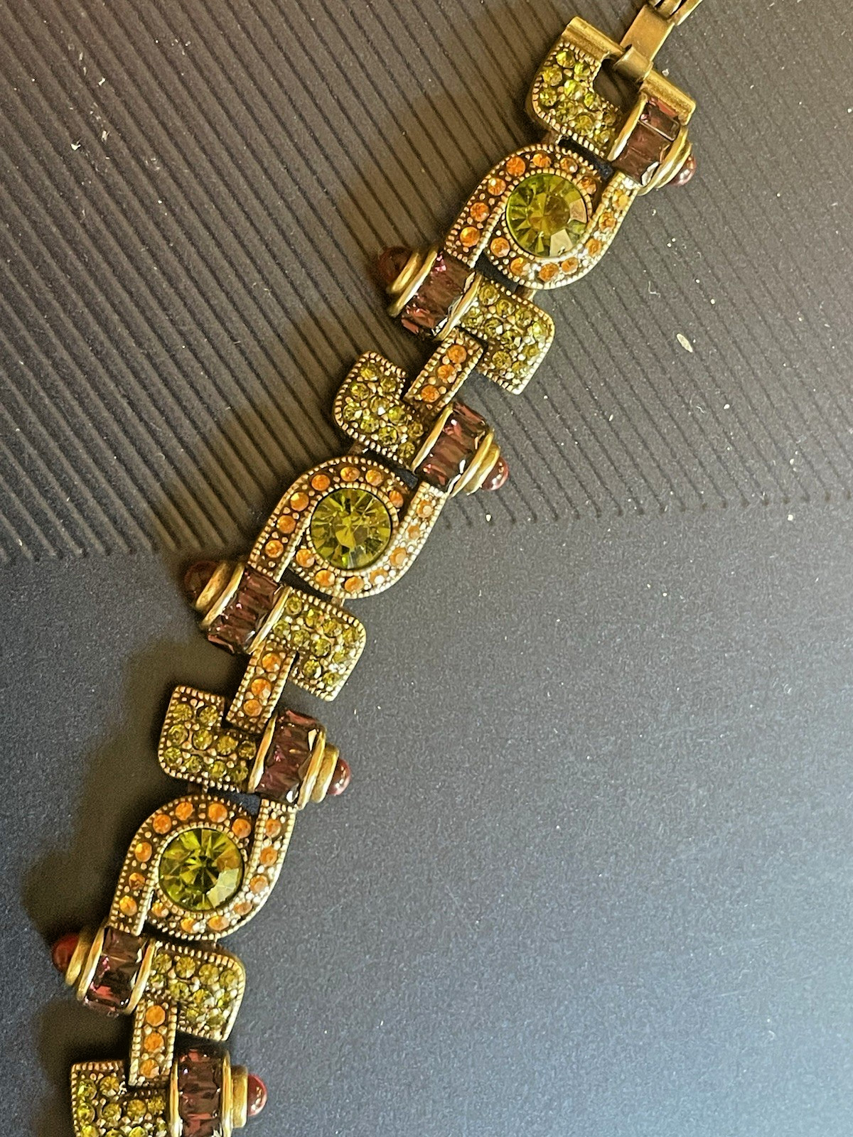 New Heidi Daus Bracelet in Original Packing. Olive Green, Red, Yellow Crystals.