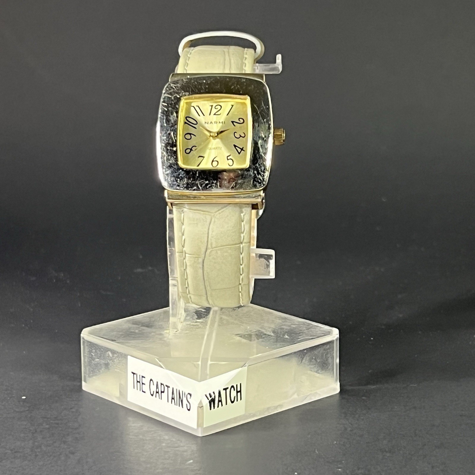 Narmi Women’s 28mm Square Silver Case Polished Bezel Gold Dial White Strap