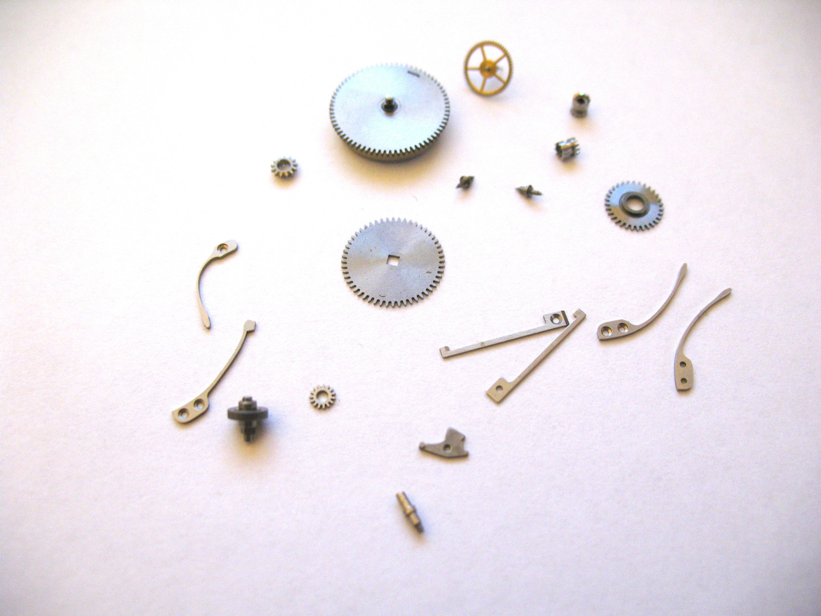 IWC,INTERNATIONAL 87 ASSORTED NEW OLD STOCK MOVEMENT PARTS