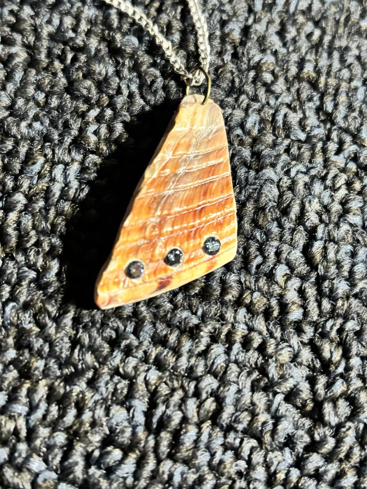 Shell Pendant Necklace. 30” silver bead chain. 3 one fifth carat blue diamonds.