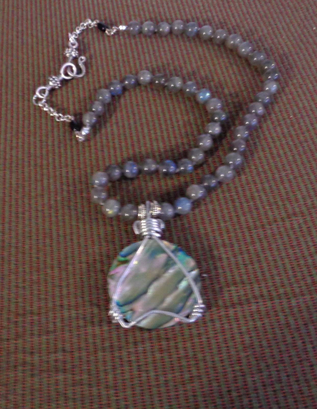 Artisan crafted, gorgeous, aluminum wrapped Paua pendant, on 19” Labradorite str
