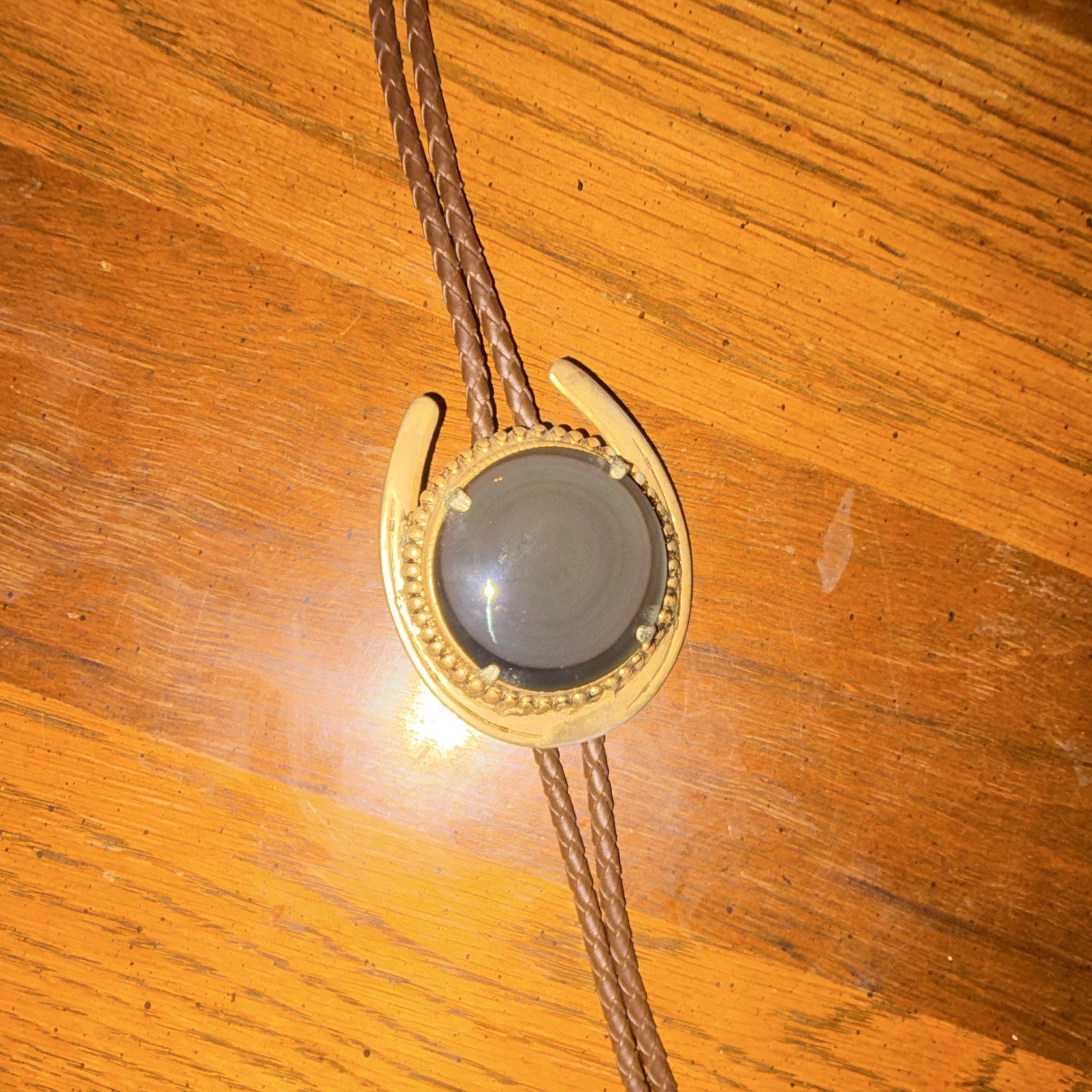 Men’s vintage Western Horseshoe Bolo Tie with natural black onyx pendant