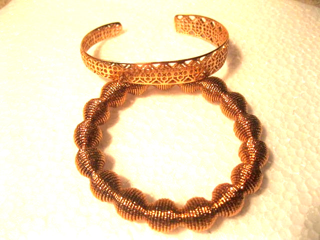 Two Rose Gold colored Bracelets – one is a bangle and the other is stretchable.