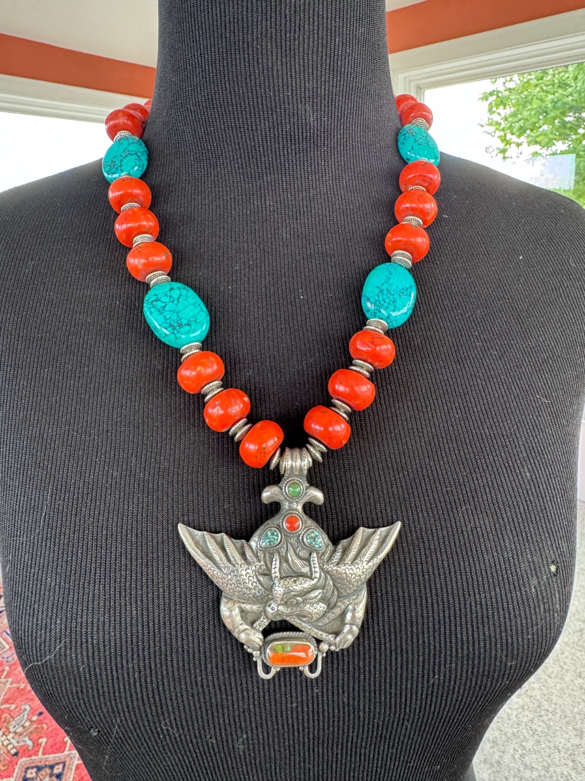 Silver Garuda pendant strung with natural coral and turquoise