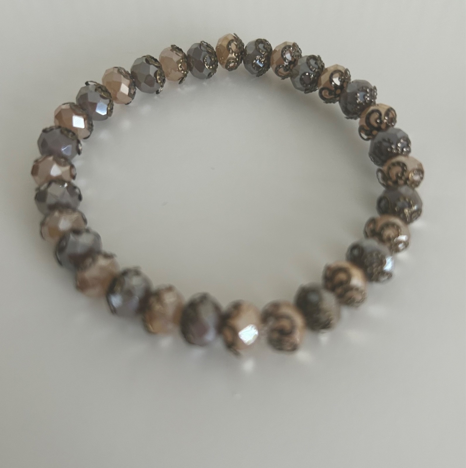 Ladies beautiful bracelet, with beige Austrian Crystal beads and copper detail
