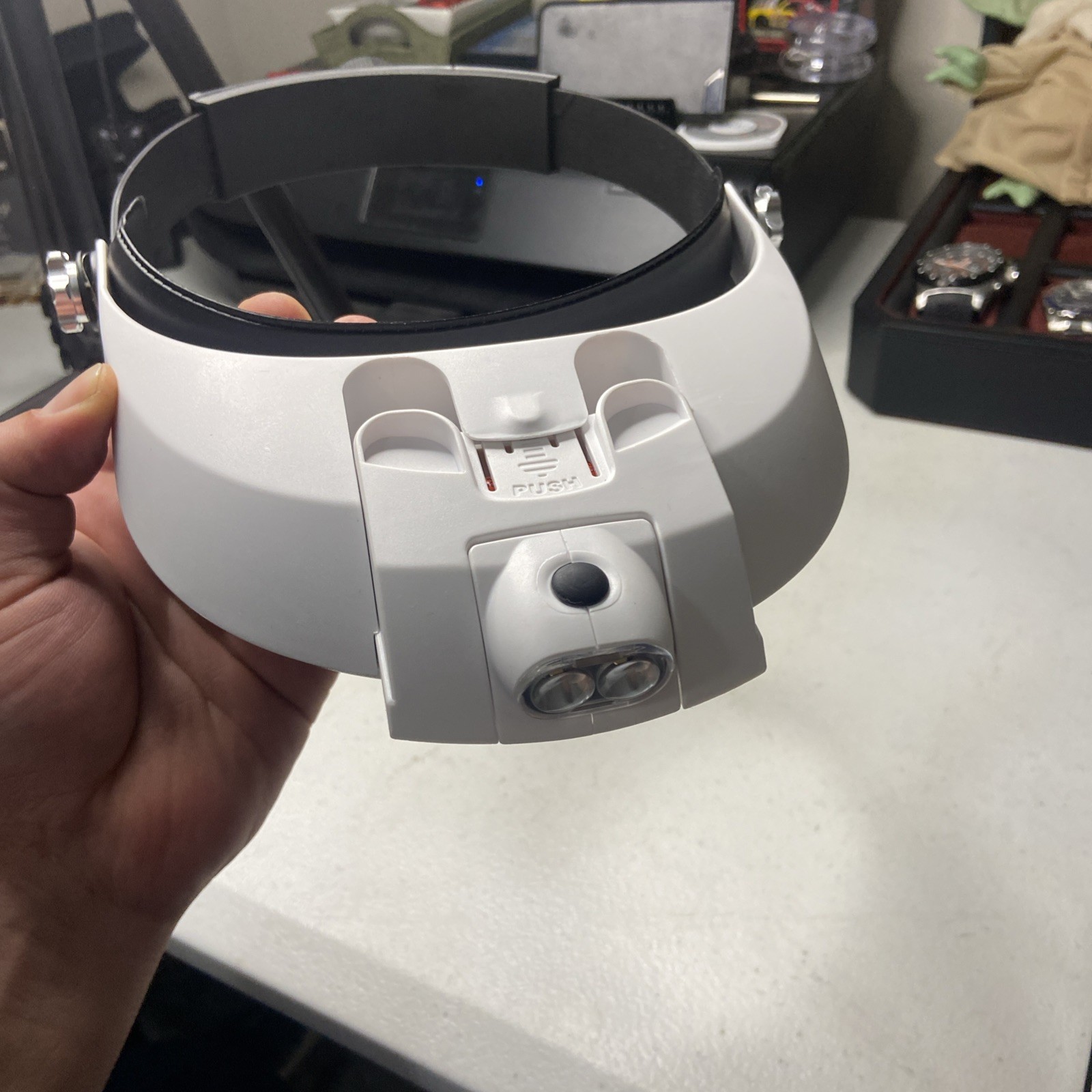 hands-free headband magnifier with a built-in LED light source.