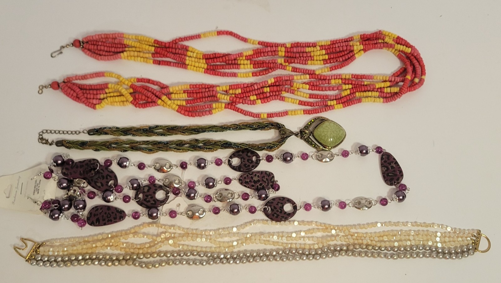 Lot of 4 beaded and multi-strand necklaces, various materials