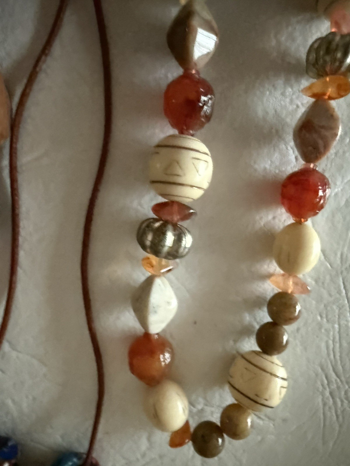 Lot of 10 necklaces, mostly wood beads, some Lucite, ethnic look earth tones