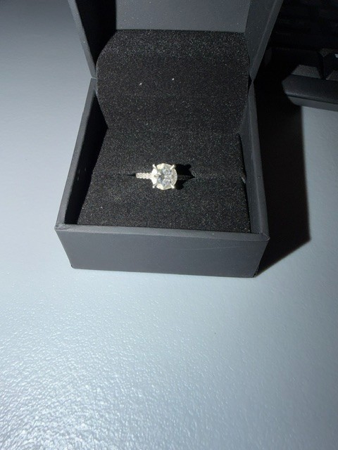 2.02 carat diamond ring. Round Brilliant single diamond, diamonds around band.